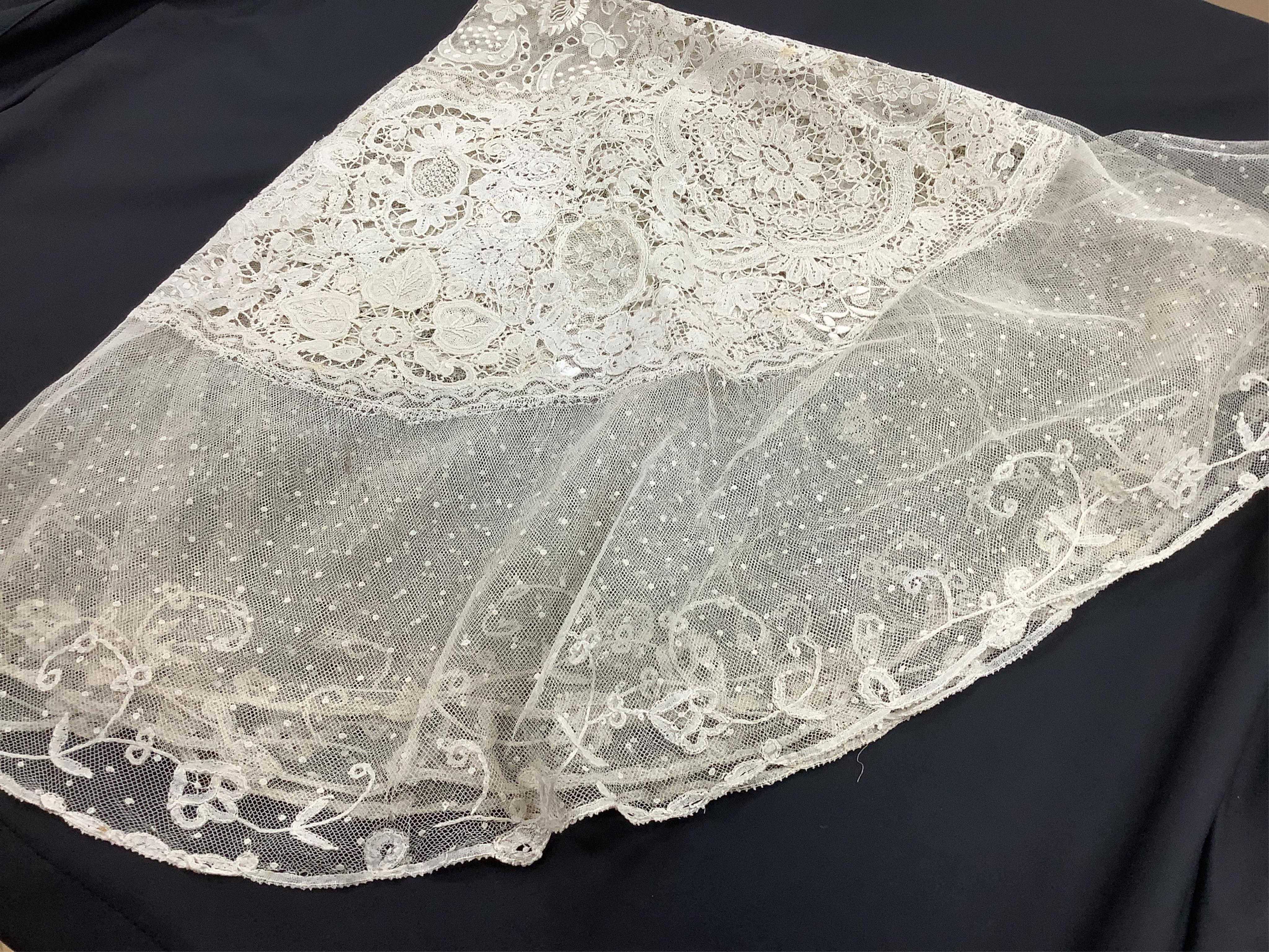 A late 19th / early 20th century circular Normandy lace table cover, with five similar smaller lace mats: all patch worked together from hand bobbin and hand needle laces, possibly part of a wedding trousseau. larger clo